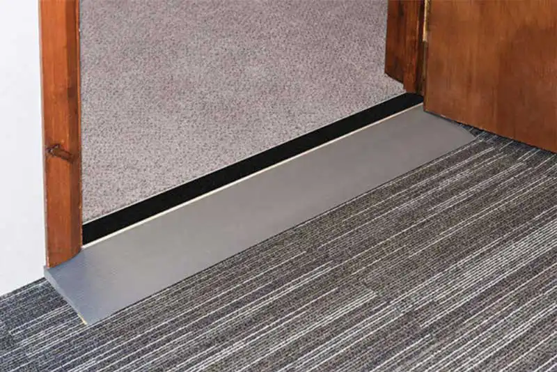 Doorline Neatslope threshold ramp self adhesive backing in use